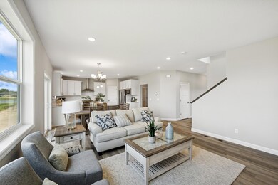 Living Room - photo is of a previous inventory home. Inquire for more details and options.