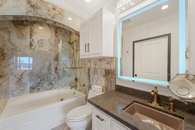 This STUNNING primary en-suite bath was remodeled