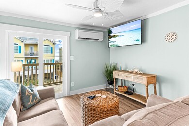 Living room featuring a wall mounted air condition