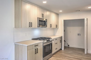 Kitchen featuring appliances with stainless steel