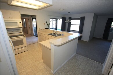 Large kitchen with breakfast counter.