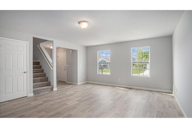 The great room flows into the kitchen, separated b