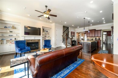 Living area with fireplace and built in bookshelve