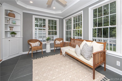 Sunroom with a healthy amount of sunlight and a ra
