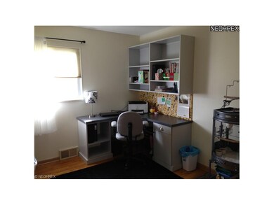 Third bedroom with hard wood floors, built in do n