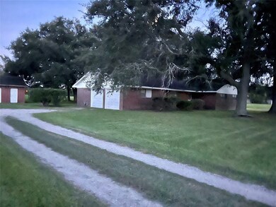 Looking at the front and left side of the house sh
