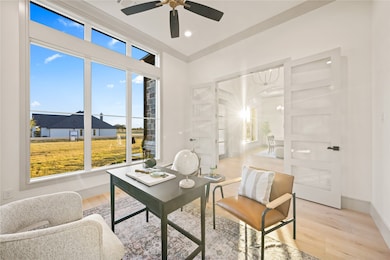 Office area with wood finished floors and recessed lighting