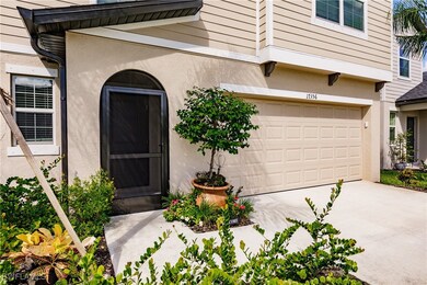 View of exterior entry with a garage