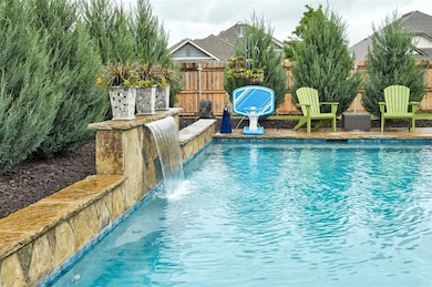 View of pool with fence