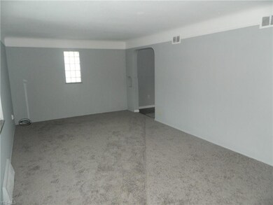 Living room with new carpet and fresh paint throug