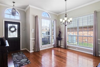 Entryway with dark hardwood / wood-style flooring,
