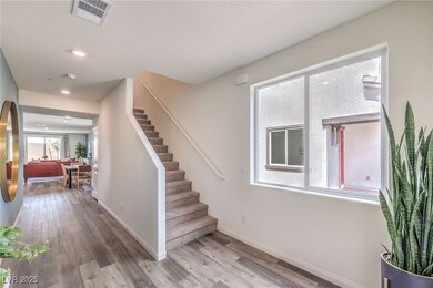 Stairs with wood finished floors, baseboards, and recessed lighting