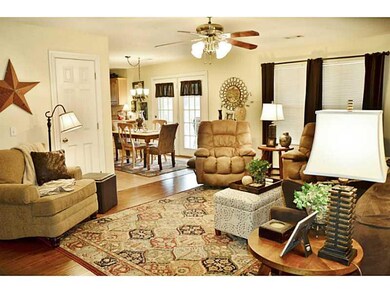 Living Room. The open floor plan connects living, dining and kitchen spaces, with gorgeous views from all angles.