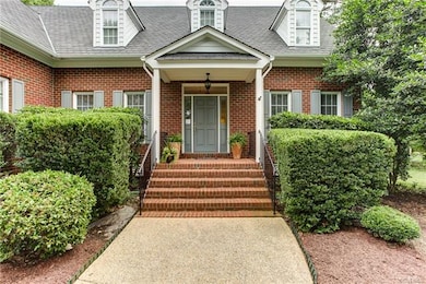Front covered brick stoop with transoms around fro