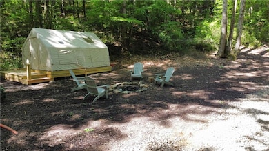 View of yard featuring an outdoor fire pit