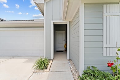 Cozy front entrance, featuring light gray siding a