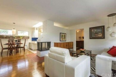 Living room with gleaming hardwood floors.