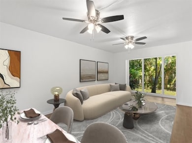Living room featuring wood finished floors and baseboards