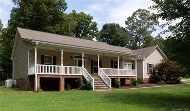 Front exterior with a large rocking chair porch.
