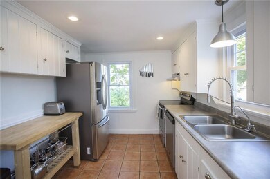 Kitchen with tiled floor and...