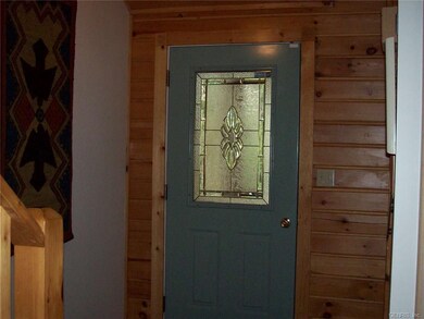 Foyer entrance-coat closet to the right.