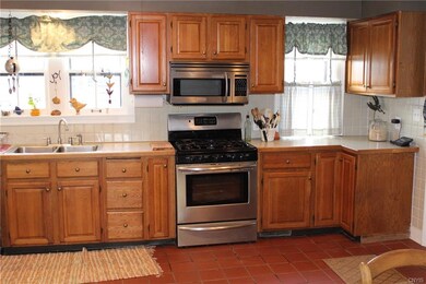 Very well lit kitchen, tile flooring, large window