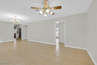 Spare room featuring baseboards, visible vents, li