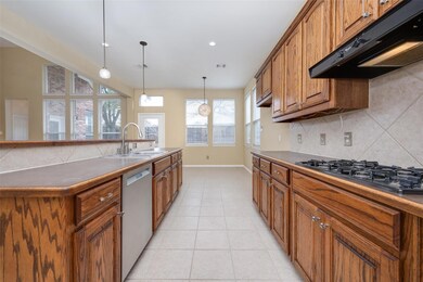 Kitchen features lots of cabinets for storage and 