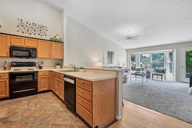 Kitchen with ceramic tile flooring, breakfast bar 