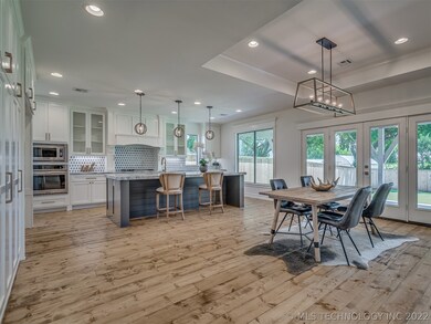 Pine floors give warmth and depth to the space. Di