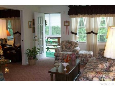 Living Room. Opens to 3 season room.