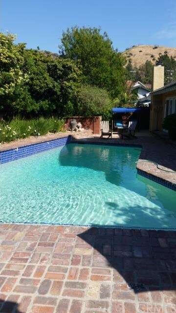 Pool area....notice luxurious landscaping and one 
