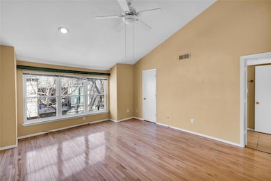 Unfurnished room featuring a ceiling fan, visible 