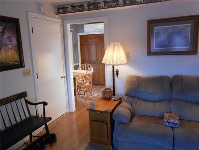 Living room into kitchen. Wood...