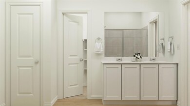 Bathroom featuring vanity and walk in shower