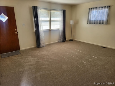 View of carpeted foyer entrance