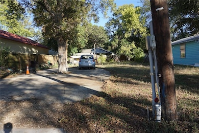 View of yard with concrete driveway