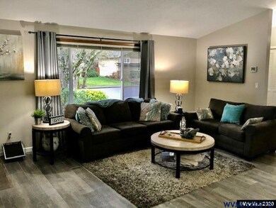 Living Room w/vaulted ceilings & tile floors.