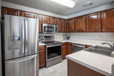 The kitchen features replaced appliances, lots of 