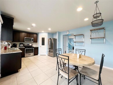 Kitchen featuring appliances with stainless steel