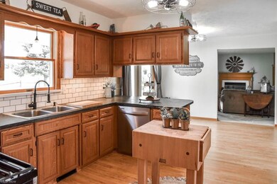 The kitchen has an updated faucet and subway tile backsplash.
