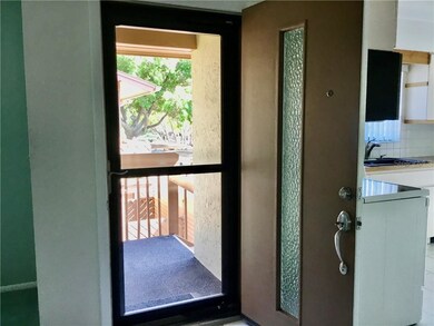 Enter into living area. Kitchen to the left.