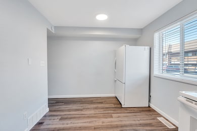 Unfurnished room with wood finished floors