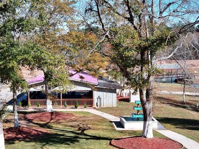 View of grassy yard with a patio