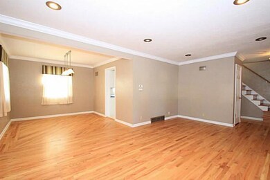 Living Room. Open living and dining area with cust