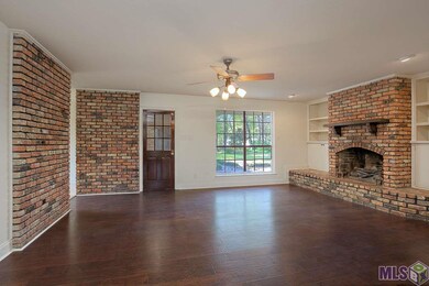 The living room has a beautiful gas fireplace with