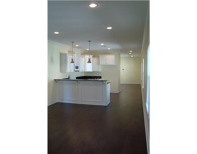 Living Room. VIEW FROM LIVING ROOM INTO KITCHEN - 