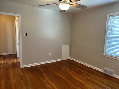 Bedroom with hardwood floor.