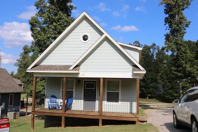 View of front of home featuring central air condit