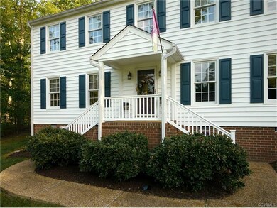 Welcoming dual-staircase front entry
